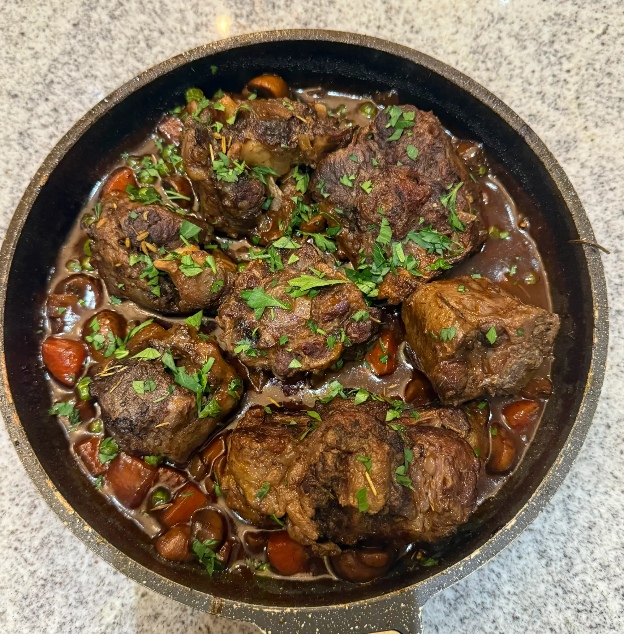 Braised oxtail with mushrooms and fresh herbs